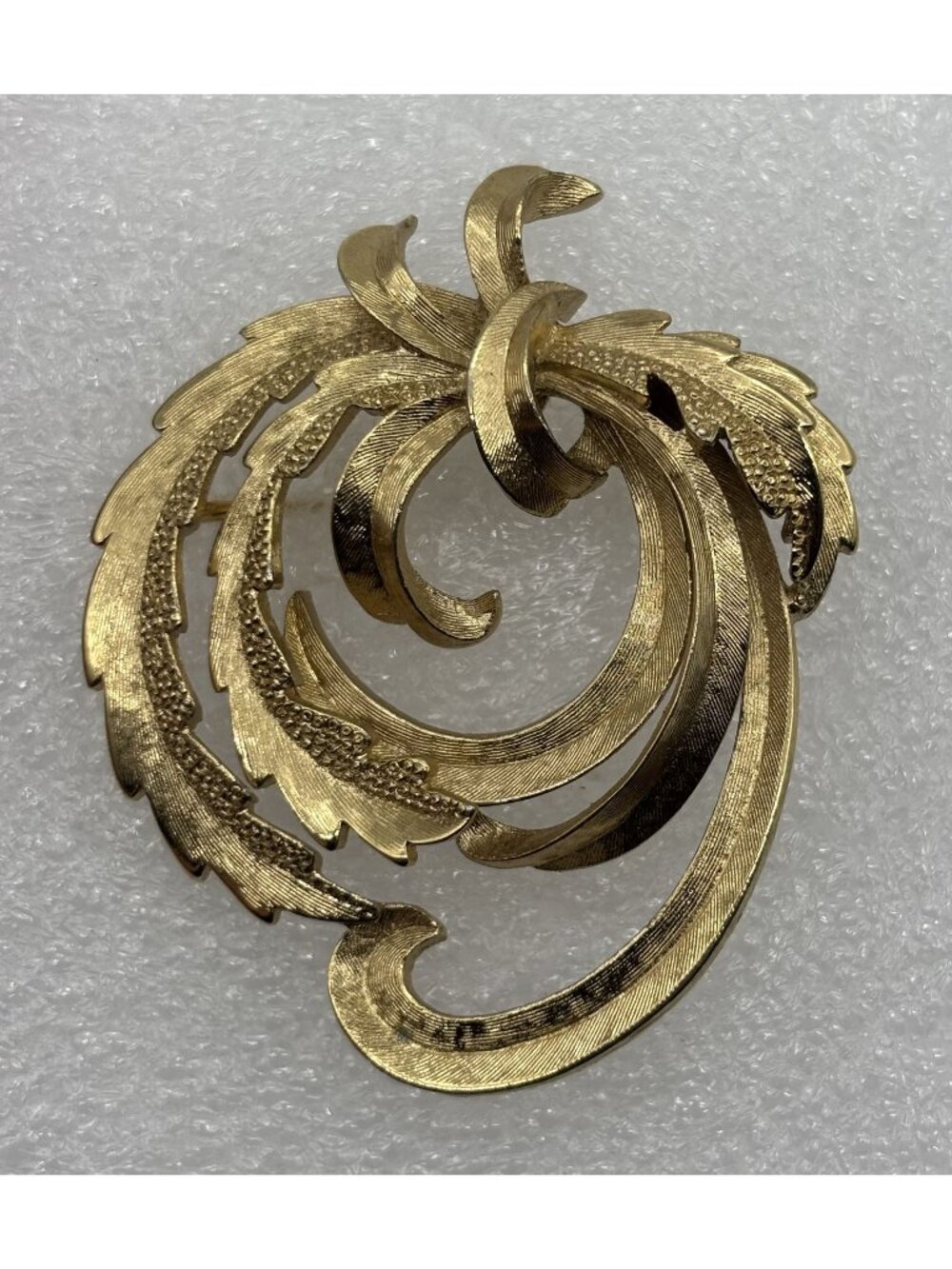 Vintage Monet Swirling Leaves Brooch Gold Plated Textured Openwork Mid 1960s 70s